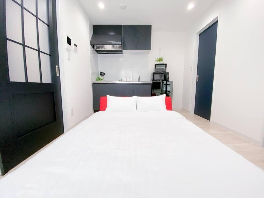 Residential Hotel Glitter Usjまで1駅5分 Osaca Quarto foto